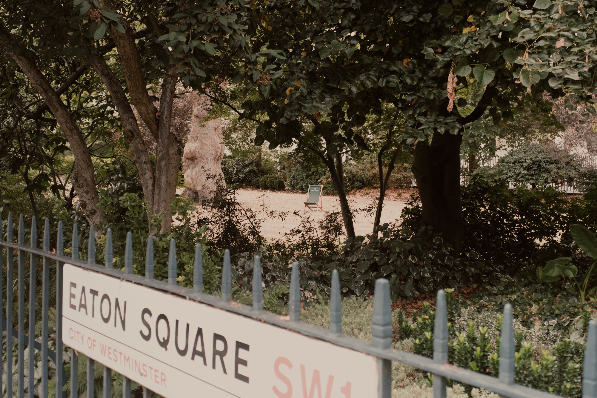 A folding chair in Eaton Square garden, Belgravia