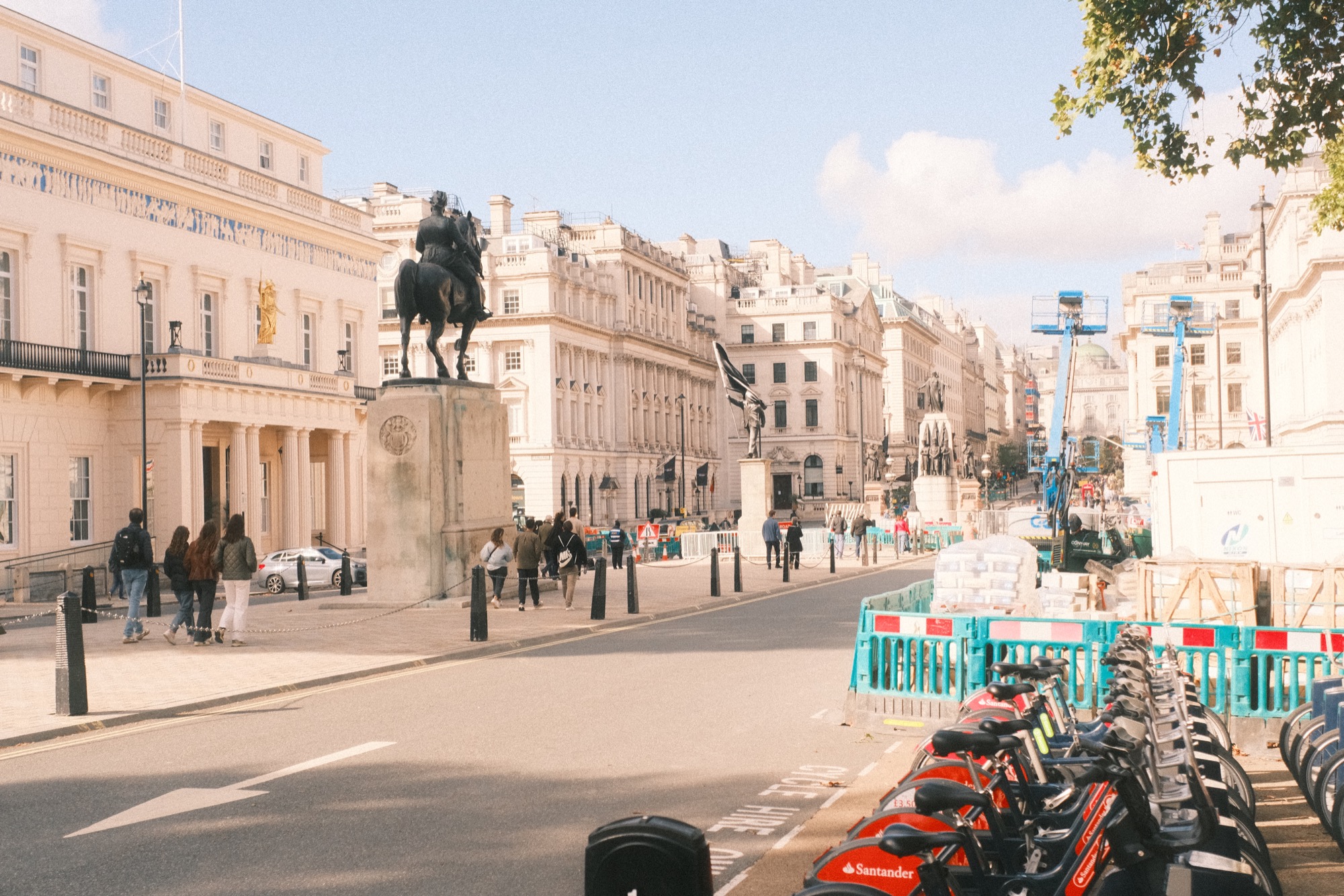Waterloo Place, a wide road with statues down its center.