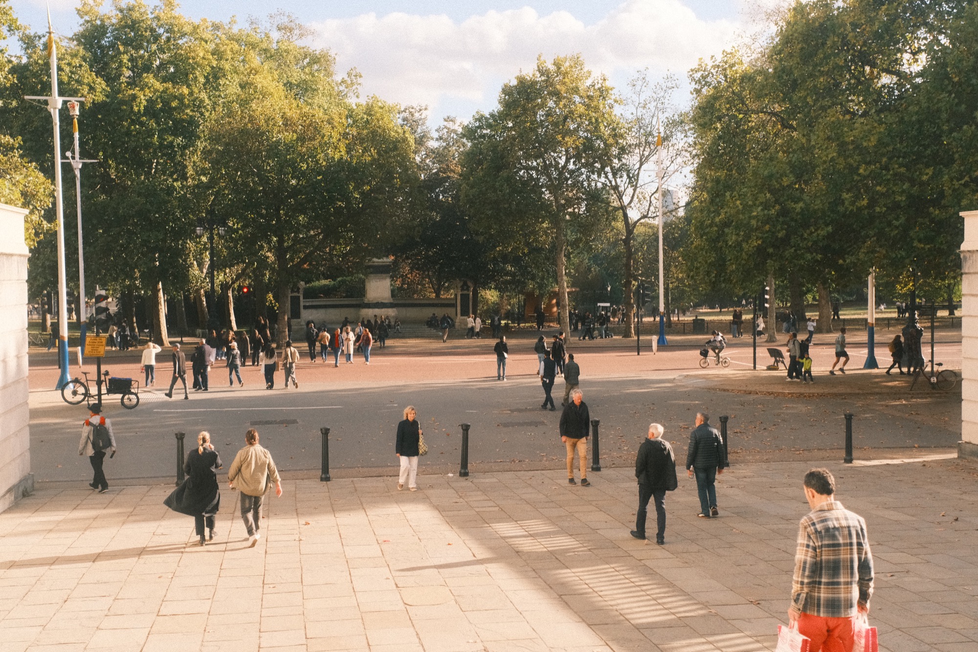 People crossing the paving at the top of the steps at Waterloo Place.